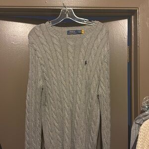 A polo sweater size medium color grey